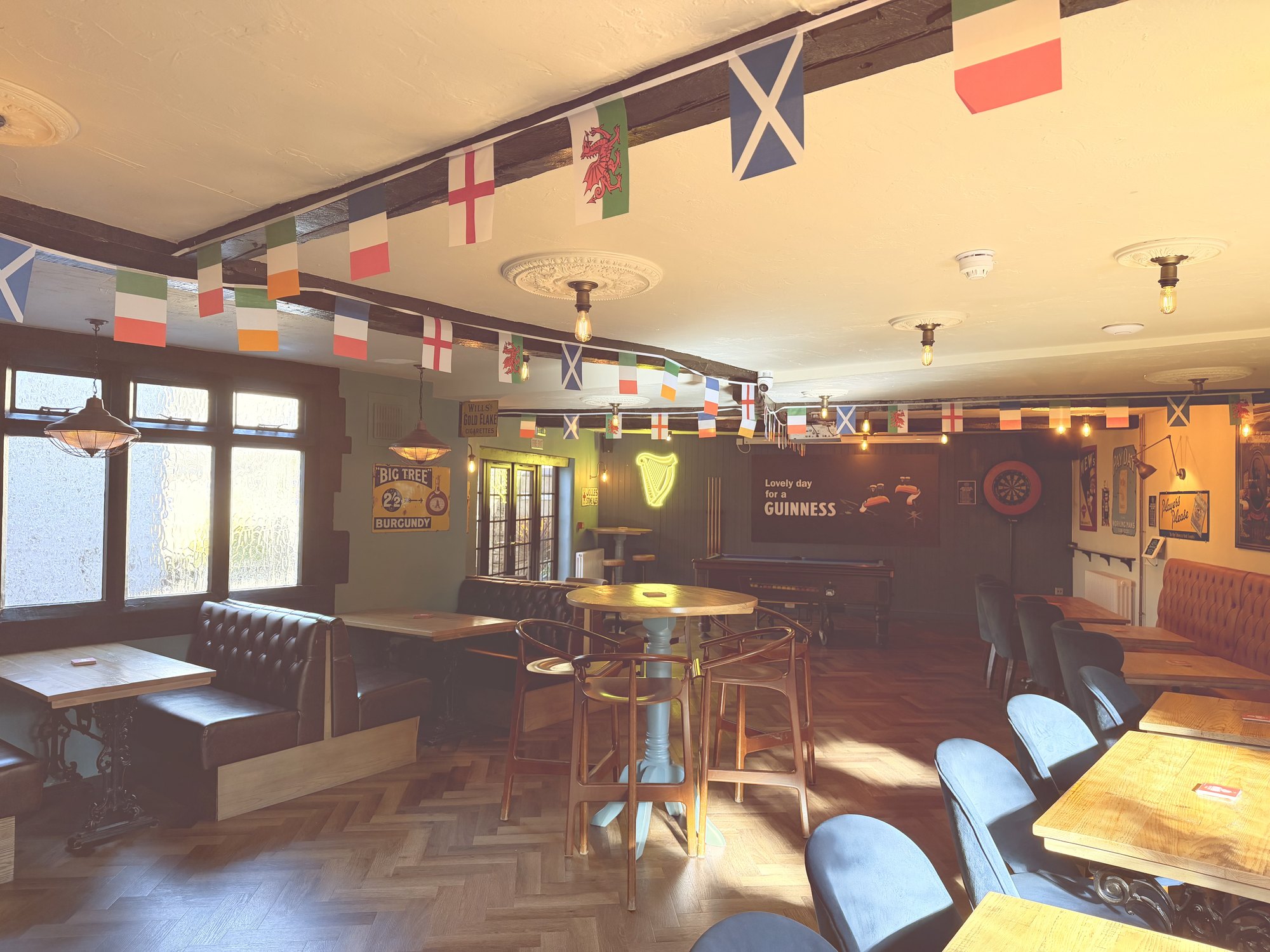 Inside Deans Walk Inn, with the bar, seating and pool table